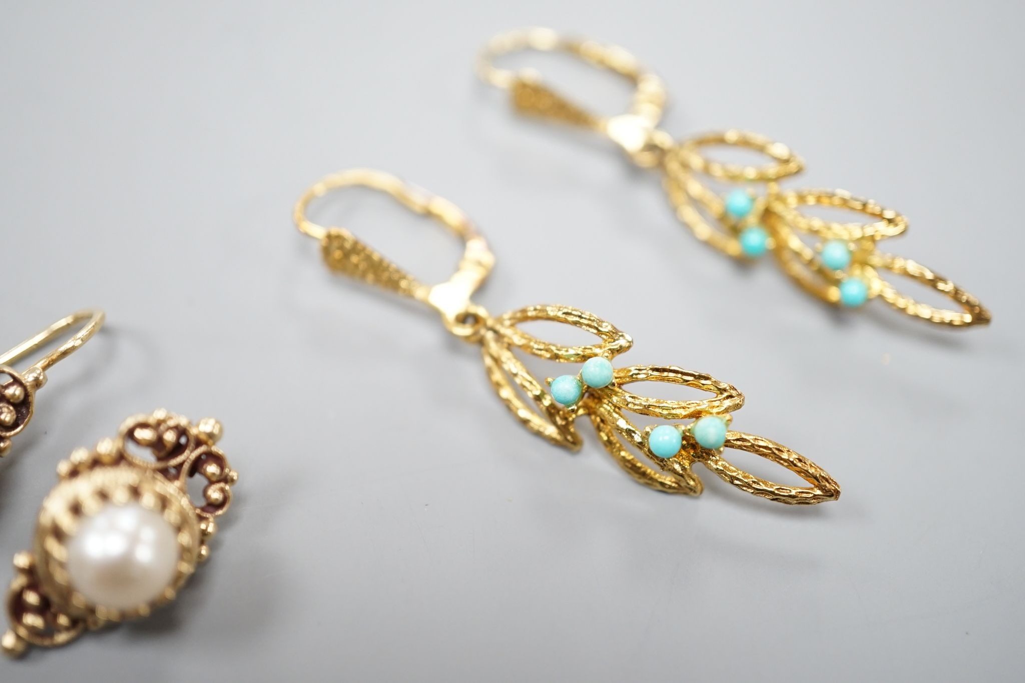 Two modern pairs of 14ct and gem set earrings, one with mabe pearl (a.f.) and one with turquoise, gross weight 7.1 grams.